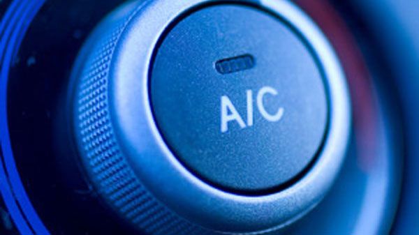 A/C button on a car dashboard