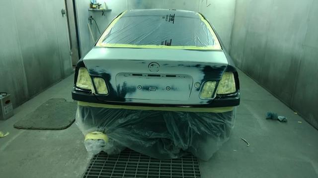 Classic car body being prepared