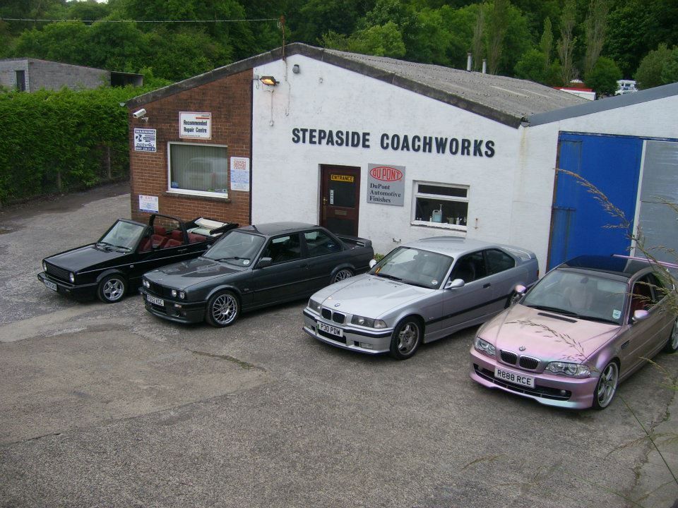 Stepaside Coachworks workshop in Stepaside with customer cars outside